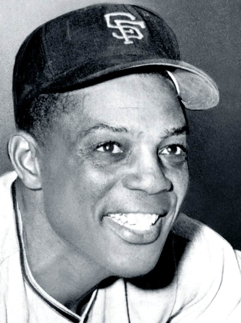A legendary moment showcasing Willie Mays making an incredible catch in the outfield, highlighting his defensive prowess.